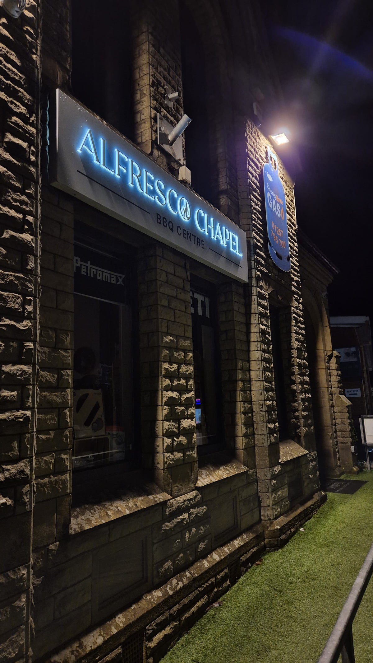 Alfresco Chapel showroom entrance with illuminated sign